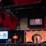 Shows audio visual rentals for set and stage design at a business meeting.
