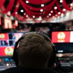 Photo shows audio visual services overseeing a live corporate meeting or event.